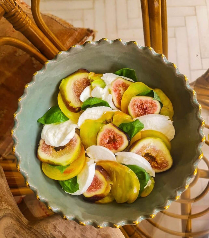 close-up of Moroccan ceramic bowl showing gold rim and artisan glaze texture