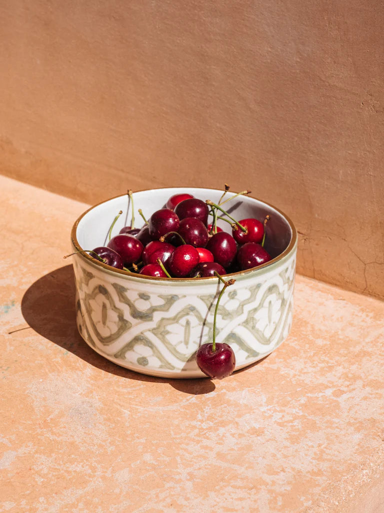 Green Moroccan Ceramic Bowl with intricate pattern filled with fresh cherries