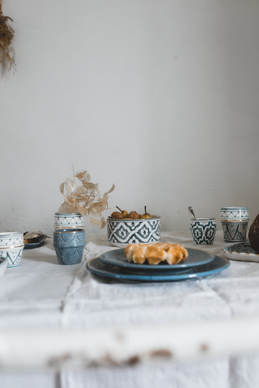 Blue Moroccan Ceramic Plate with intricate decorative pattern on a woven placemat