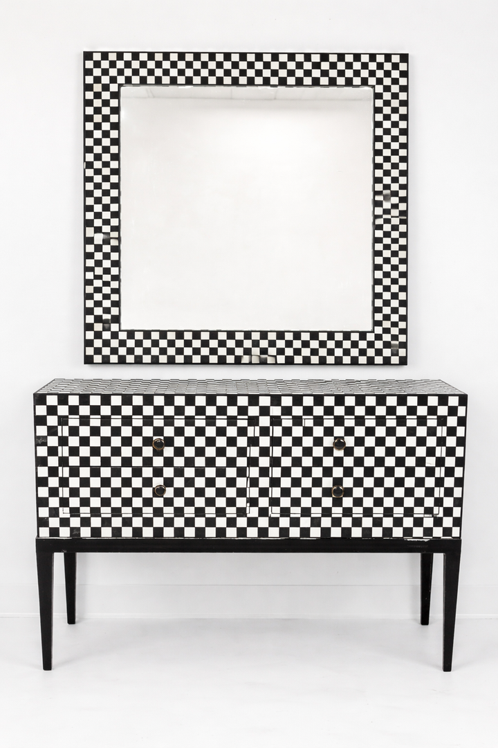 Black and white checkered cabinet with matching mirror on a white background
