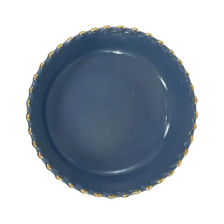 Handcrafted blue stoneware bowl in modern table setting