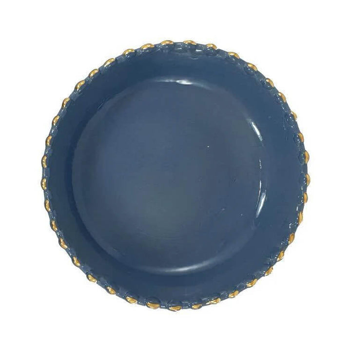 Handcrafted blue stoneware bowl in modern table setting