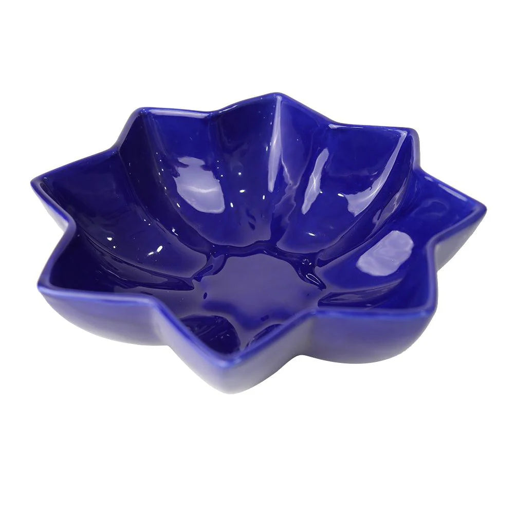 Blue ceramic star-shaped bowl on a white background